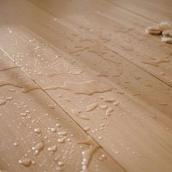 water spilled on light hardwood floor